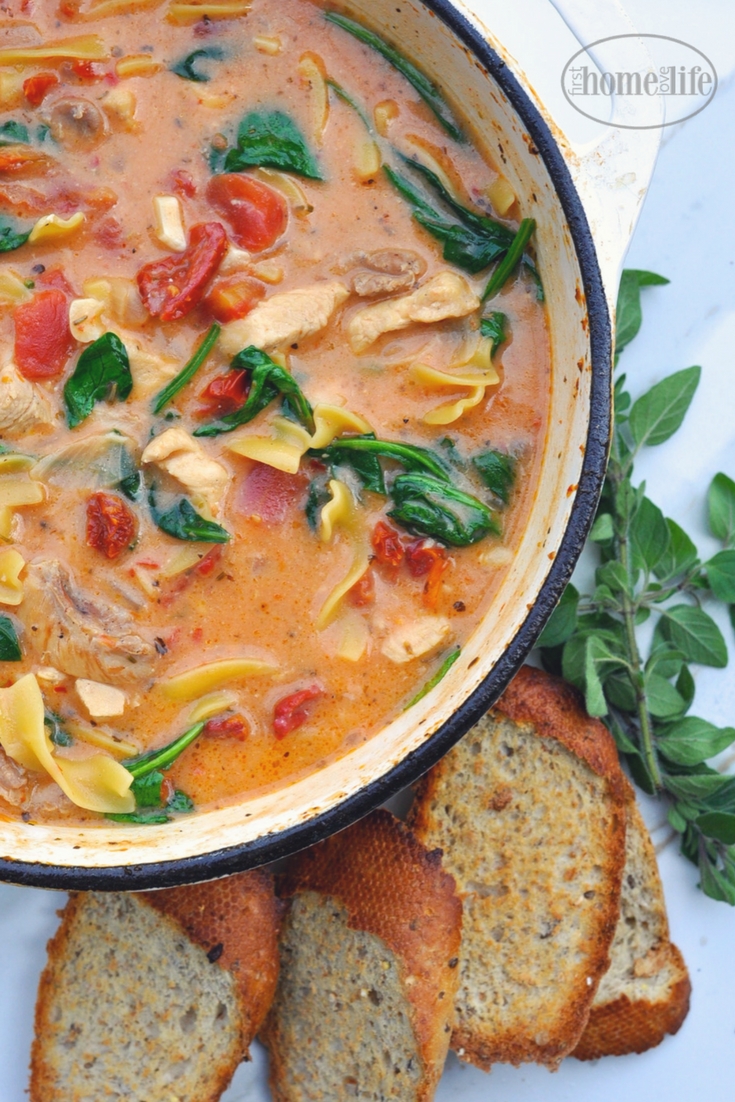 https://www.firsthomelovelife.com/wp-content/uploads/2018/01/Creamy-Tuscan-chicken-noodle-soup-is-the-perfect-cold-weather-meal-Chicken-noodles-sun-dried-tomatoes-and-spinach-in-a-creamy-garlic-tomato-broth-via-firsthomelovelife.com_.jpg